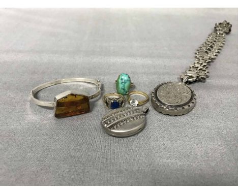 NINE CARAT GOLD GEM SET RING along withan unmarked example, silver bangle and two unmarked lockets