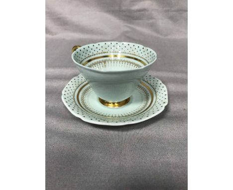 BLUE AND GILT PARAGON TEA SERVICE together with a floral and gilt part tea service
