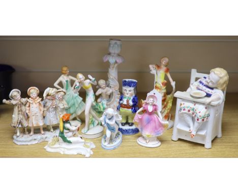 A collection of Art Deco ceramic dancing ladies, a 19th century figural box, a candlestick and a Toby jug, etc., tallest 22cm