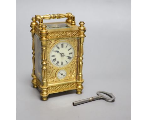 An early 20th century French brass carriage clock, with alarm, height 13.5cm with handle down