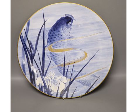 A Royal Worcester Aesthetic period circular plaque, decorated with a carp, diameter 36cm