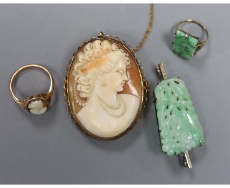 A 9ct mounted oval cameo shell brooch, 47mm, gross12.6 grams, two rings including 9ct cameo and yellow metal and jade and a w