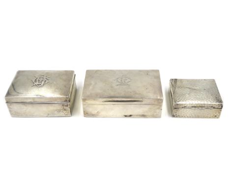 Two Victorian silver cigarette boxes by Walter Raymond and Goldsmiths & Silversmiths Co, London 1893/5 and an Edwardian silve