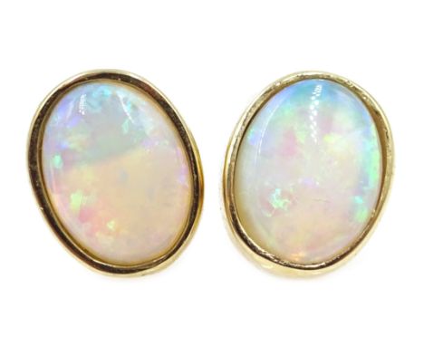 Pair of 9ct gold opal stud earrings, stamped 375 Condition Report approx 1.6gm, length = 0.9cmClick here for further images, 