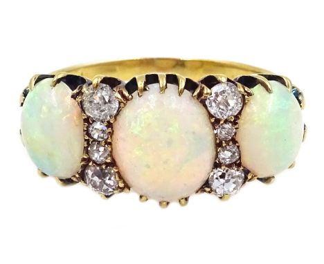 Victorian gold three stone opal and eight stone diamond ring, stamped 18c Condition Report Approx 4.1gm, size N, central opal