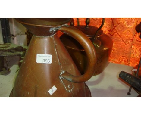 Vintage copper kettle and copper measuring jug