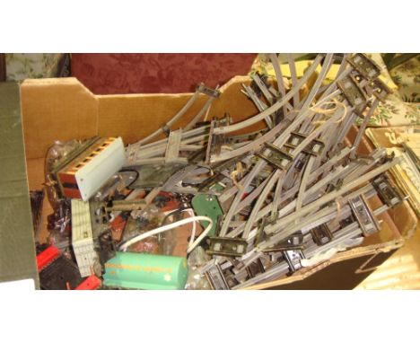 Box of vintage 0 guage track and carriages