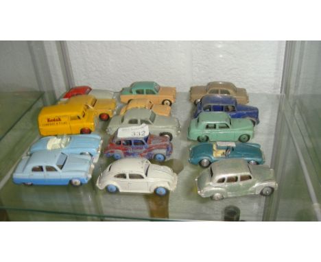 Shelf of 15 assorted vintage toy cars, some Dinky & Corgi including Austin Devon, Minx, Austin Taxi, Volkswagon Beetle, Corgi