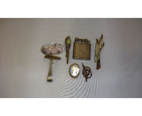Silver plated Dunhill petrol lighter with engine turned decoration, silver mounted claw brooch and one other, miniature corks