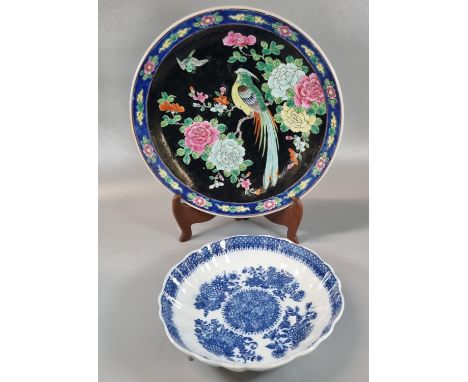 Japanese porcelain polychrome charger with Chinese style rose enamel on a black ground, decorated with bird of paradise among