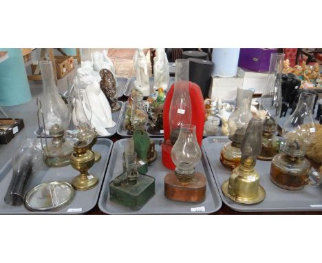 Three trays of oil lamps; many with metal enamel bases, some with glass bases, some metal wall hanging oil lamps, camping lam
