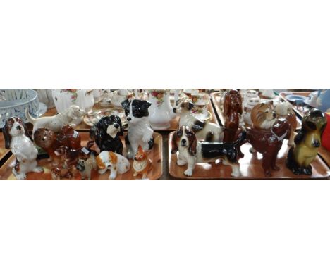 Two trays of china dog figures of include: Kingston Pottery, Melba Ware, Beswick, Dachshund moneybox,Cats & Co. puppy, Jack R