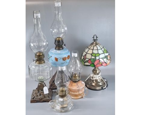Group of assorted  lamps to include: four brass single burner oil lamps, two with cast metal bases, two of chamber form toget
