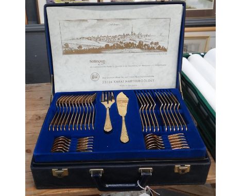 Briefcase of Solingen 23-24 carat gold plated cutlery with COA. (B.P. 21% + VAT)  Three trays, one dinner knife missing, one 