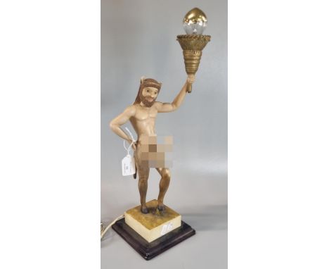Slightly alarming novelty table lamp in the form of a well endowed Satyr figure supporting flaming torch.  46cm high (dont lo