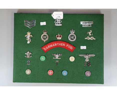 Collection of Military badges and insignia, to include: Royal Military Police, Third Reich Eagle, Carmarthen Fusiliers patch,