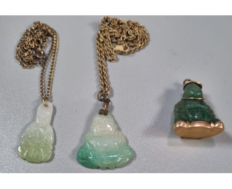 Two jade pendants on chains and another similar yellow metal mounded in the form of a Buddha.  (3)  (B.P. 21% + VAT) 