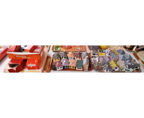 Two trays of plastic model railway track side buildings together with various other model railway accessories including Hornb