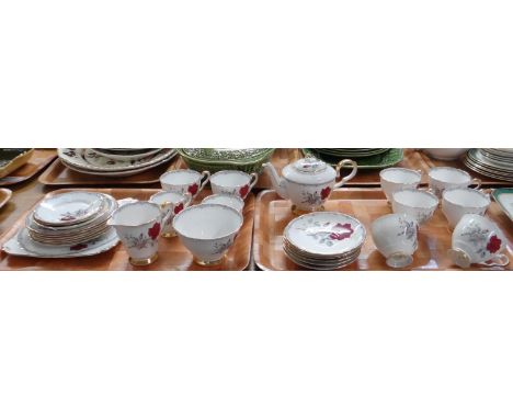 Two trays of Royal Stafford English bone china 'Roses to Remember' design tea ware to include: cups, saucers, small teapot, m