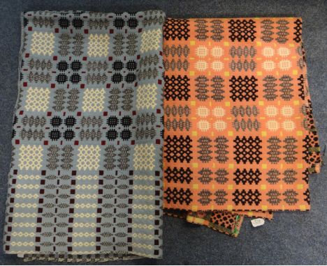 Two vintage woollen Welsh tapestry blankets, one on a blue ground and one on a pink ground, both traditional Caernarvon desig
