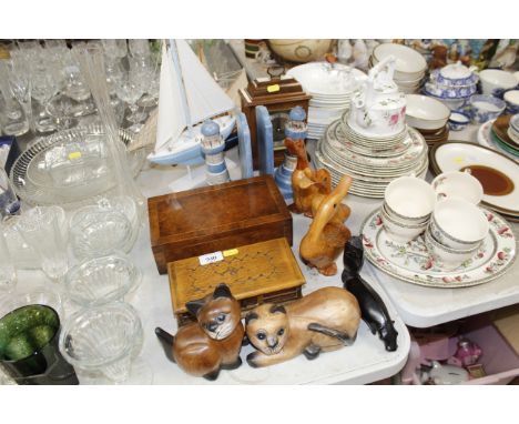 A quantity of woodenware including duck ornaments, lighthouse bookends, model ships and mantel clock etc