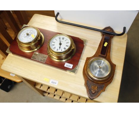 A clock and barometer set with commemorative plaque for Shotley Sailing Club together with an oak banjo shaped barometer