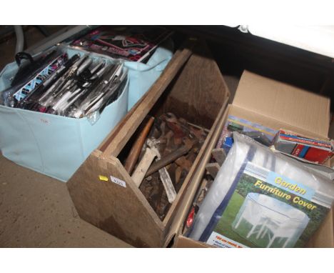 A wooden tool carrying crate with a quantity of various tools to include hammers, spanners etc.