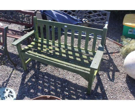 A wooden painted two seater garden bench 