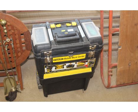 A Stanley mobile work centre and a quantity of various tools, hose fittings, jubilee clips etc.