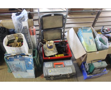 A small set of metal folding steps and two crates of various tools to include clamps, hand saws, oil cans etc.