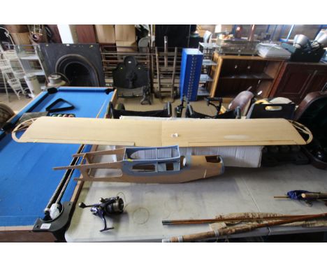 A Flare Cub model aeroplane kit with control panel and engine (part built) instructions included 