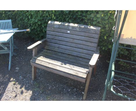 A wooden garden two seater bench 