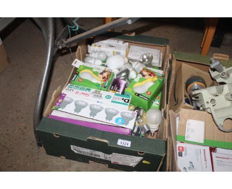 A box containing light bulbs, electrical fittings etc.