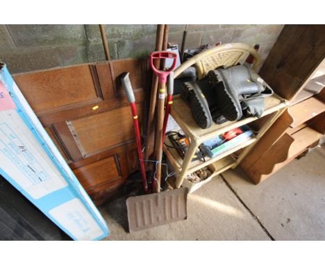 A quantity of tools to include a large shovel, garden shears, rake, garden hoe etc.