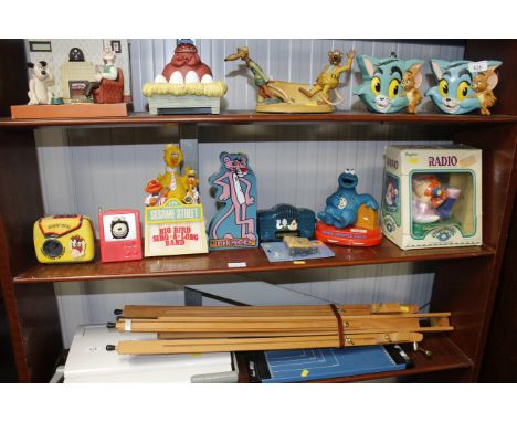 A collection of novelty transistor radios including Cabbage Patch Kids, Cookie Monster, Pink Panther, Sesame Street etc.