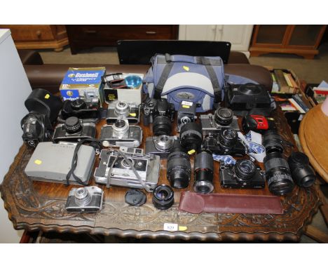 A large quantity of various cameras including Praktica, Polaroid etc.