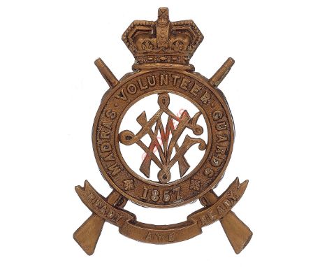 Indian Army. Madras Volunteer Guards OR’s Victorian helmet badge. Good scarce die-stamped brass example. Set on crossed rifle