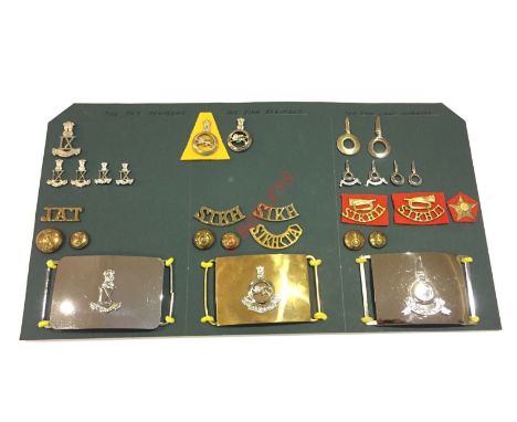 Indian Army post Independence. Jat and Sikh Regiments and Sikh Light Infantry Insignia. Carded display of the three units inc