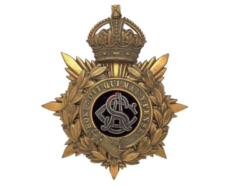 Badge. Army Service Corps Officer’s helmet plate circa 1901-14. A good gilt example. Crowned star mounted with wreathed Garte