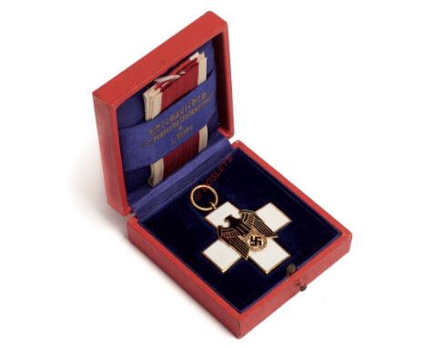 German Third Reich cased Social Welfare Decoration 3rd Class. A very fine gilt and enamel breast badge. White Geneva Cross, t