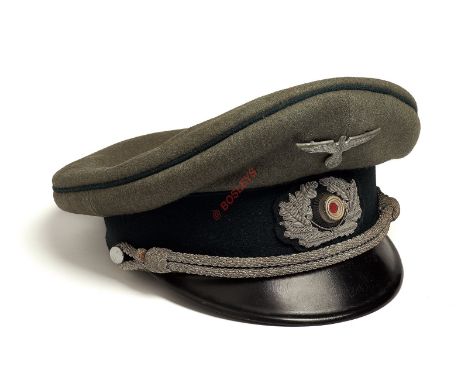 German Third Reich Army Officer’s peaked cap. An example of field grey woollen cloth with green piping to the welt of the cro