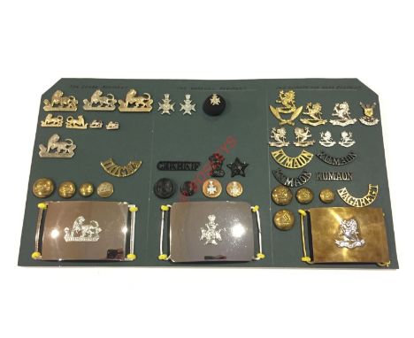 Indian Army post Independence. Dogra and Garhwal Regiments and Kumaon & Naga Regiment Insignia. Carded display of the three u