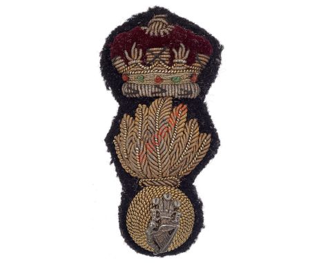 Royal Irish Fusiliers Officer’s bullion forage cap badge. A good example. Flaming grenade surmounted by coronet with crimson 