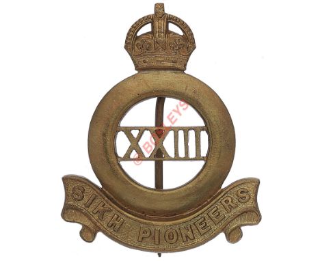 Indian Army. 23rd Sikh Pioneers pagri badge. Well cast brass crowned Sikh quoit resting on “Sikh Pioneers” scroll; “XXIII” to