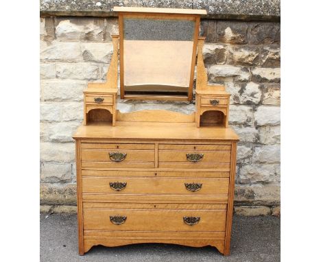 A Birds Eye Maple Dressing Table, with two drawers beneath, galleried mirror flanked by two trinket drawers to either side, a