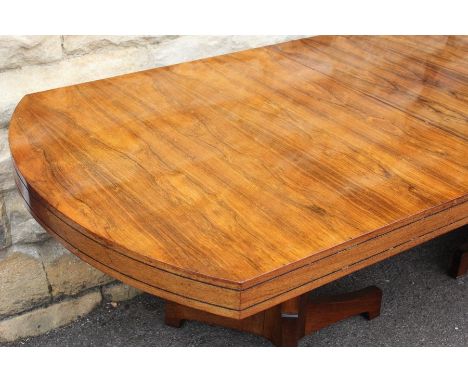 An Art Deco Rosewood Dining Table, the table raised on twin tripod pedestals, approx 272 l x 100 w&nbsp; cms. (length in cms 