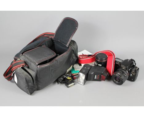 A Canon EOS 10 Camera; the Canon Zoom Lens&nbsp; EF 35-70 mm 1:3.5-4.5, stamped to base 2153695, with shoulder strap, togethe