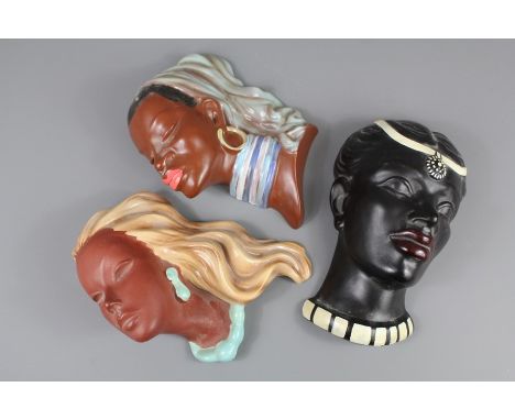 Three Art Deco West German Ceramic Profiles, the first being an African woman nr 3427 approx 18 x 24 cms, the other a girl wi