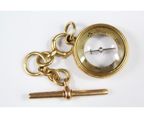 A 18ct Gold Encased Compass and Fob, nr 3221 suspended from an 18 ct gold fob chain, approx 18 gms total, the T-bar possibly 