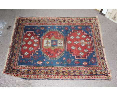 Antique Turkish Wool Carpet, approx 125 w x 150 l, with cobalt blue and red ground, three central gul, with geometric border,